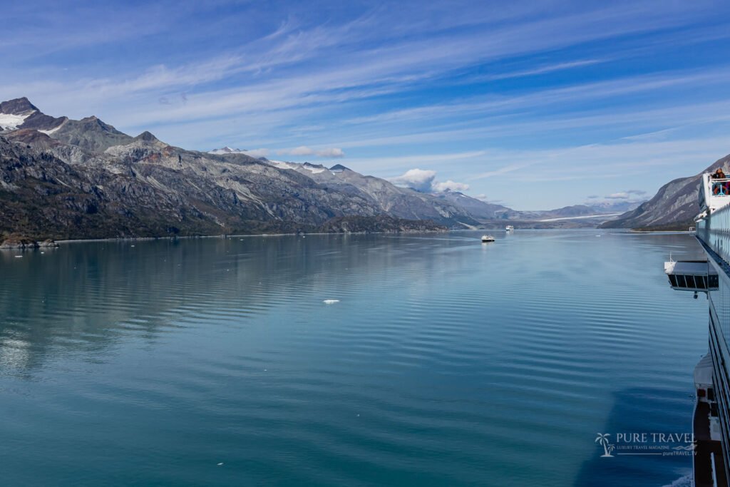 Cruise ship sailing through icy waters of Glacier Bay National Park, Alaska, offering scenic glacier views